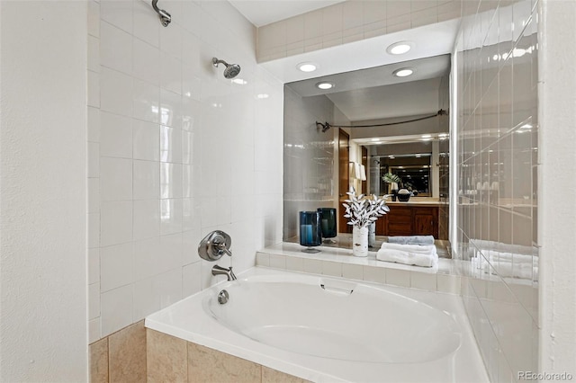 bathroom featuring tiled shower / bath and recessed lighting
