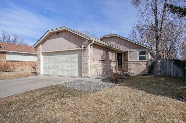 ranch-style house featuring a garage, driveway, fence, and brick siding