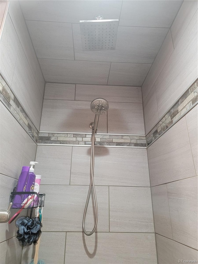 bathroom with tiled shower