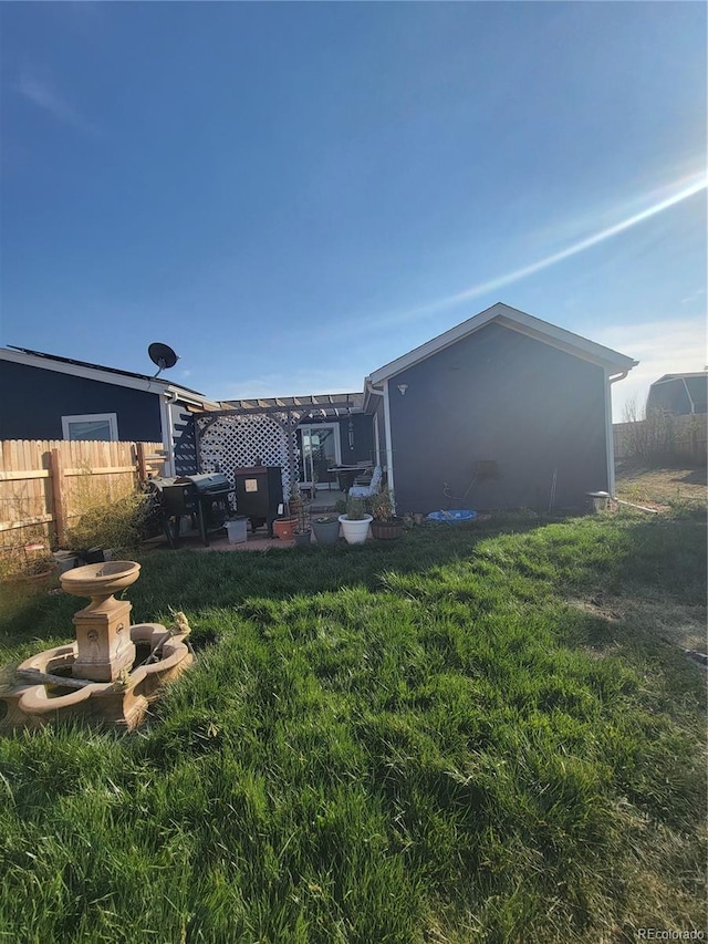 view of yard featuring a patio area and a pergola