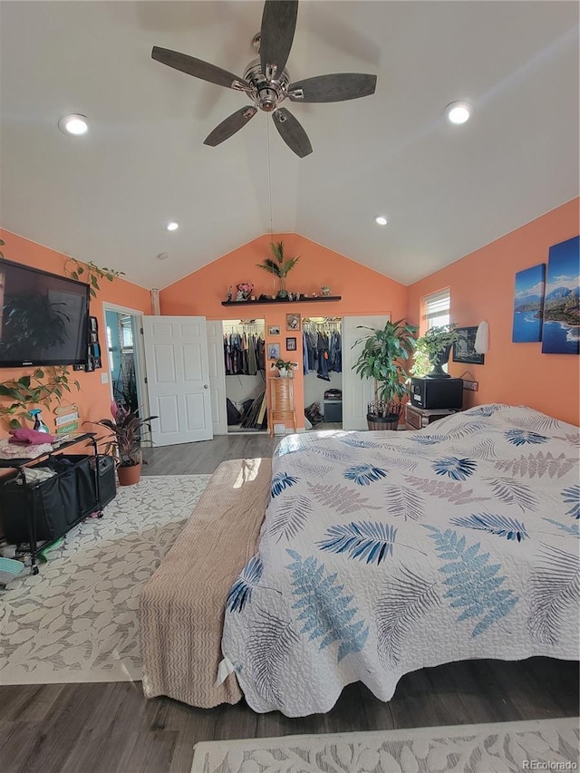 bedroom with lofted ceiling, hardwood / wood-style floors, and ceiling fan