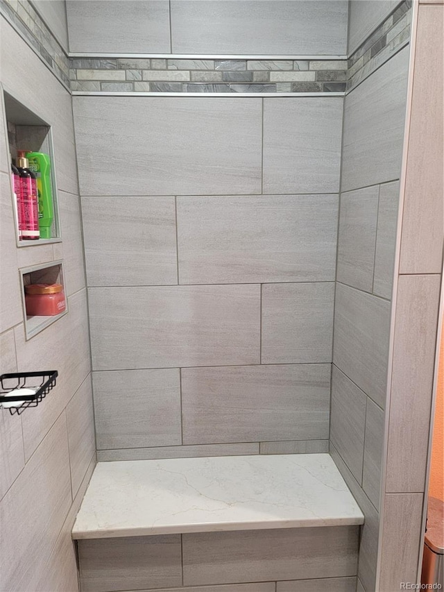 bathroom featuring a tile shower