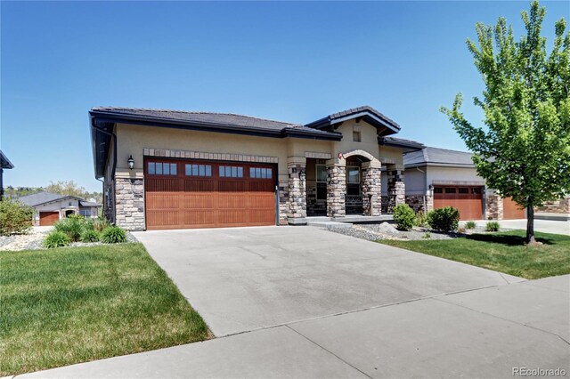 365 Casalon Pl, Superior, CO 80027 - view of front of property featuring stone siding, an attached garage, driveway, and stucco siding