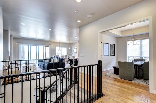365 Casalon Pl, Superior, CO 80027 - hall with an upstairs landing, a chandelier, wood finished floors, recessed lighting, and baseboards