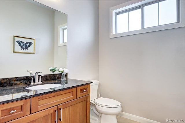 365 Casalon Pl, Superior, CO 80027 - bathroom featuring toilet, vanity, tile patterned flooring, and baseboards