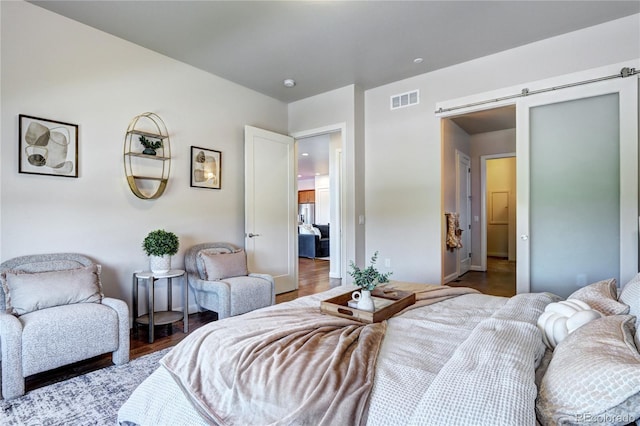 365 Casalon Pl, Superior, CO 80027 - bedroom featuring wood finished floors and a barn door