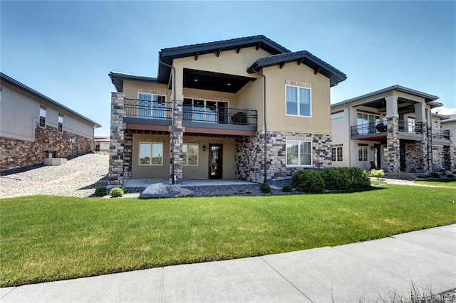365 Casalon Pl, Superior, CO 80027 - back of property with a balcony, stucco siding, a yard, and a patio