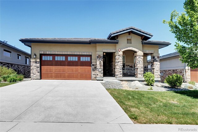365 Casalon Pl, Superior, CO 80027 - view of front of property with driveway, a garage, stone siding, stucco siding, and a tile roof