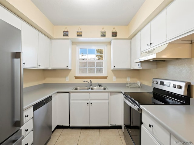 kitchen with white cabinets, light tile patterned floors, stainless steel appliances, and sink