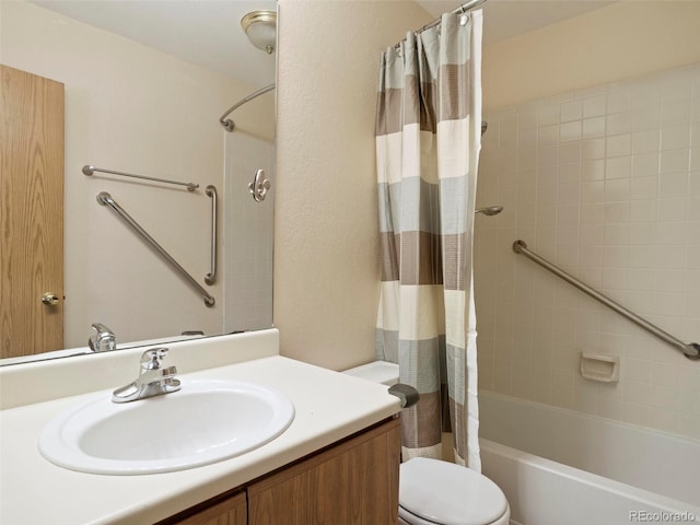 full bathroom with vanity, shower / tub combo, and toilet