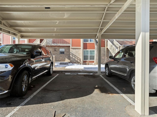 view of vehicle parking featuring a carport