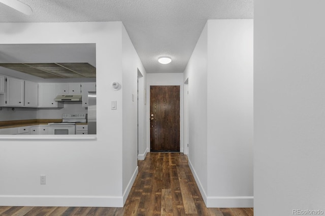 corridor with dark wood-type flooring