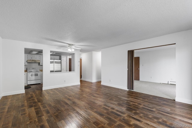 unfurnished living room featuring ceiling fan, a textured ceiling, and dark hardwood / wood-style flooring