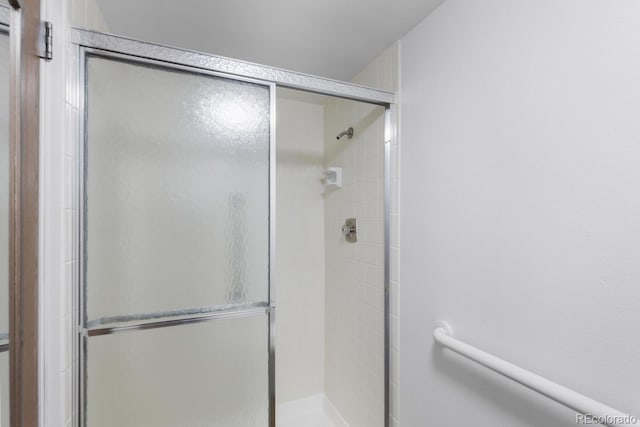 bathroom featuring an enclosed shower