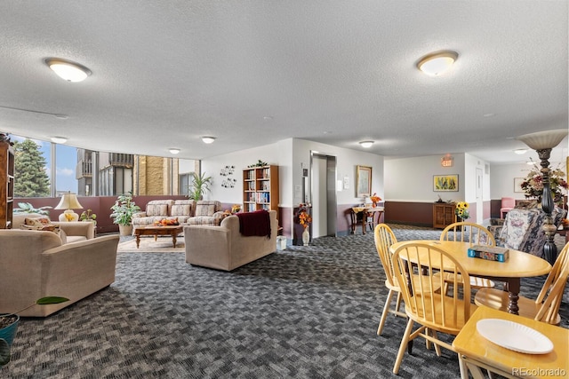 dining area with dark carpet and a textured ceiling