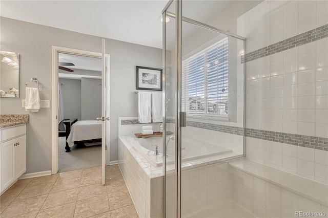 bathroom with tile patterned flooring, vanity, and independent shower and bath