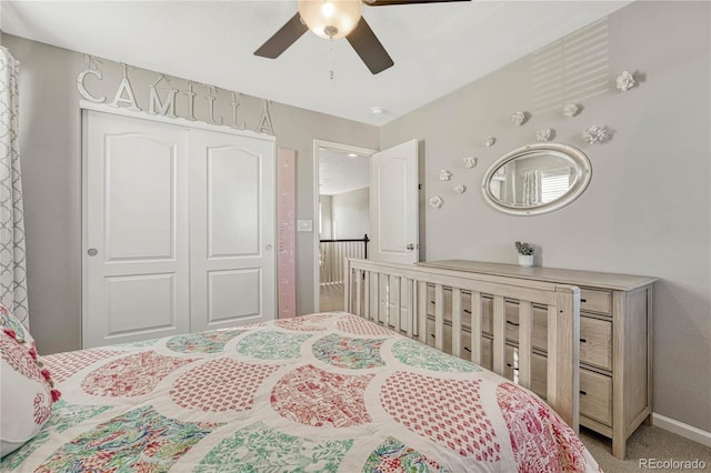 bedroom featuring carpet floors, ceiling fan, and a closet