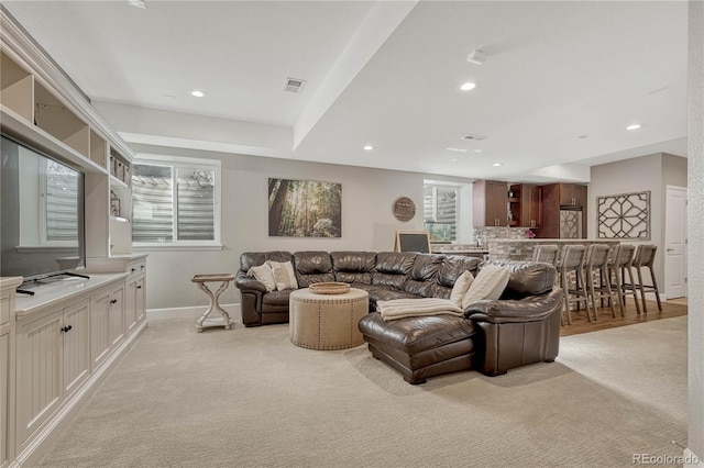 carpeted living room featuring a wealth of natural light