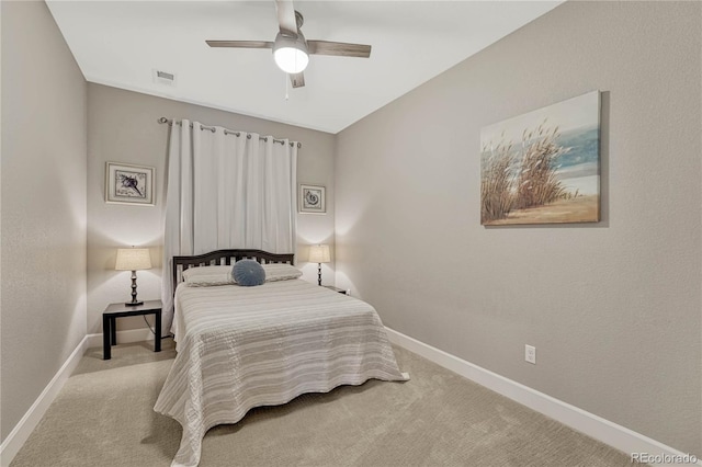 bedroom featuring light carpet and ceiling fan