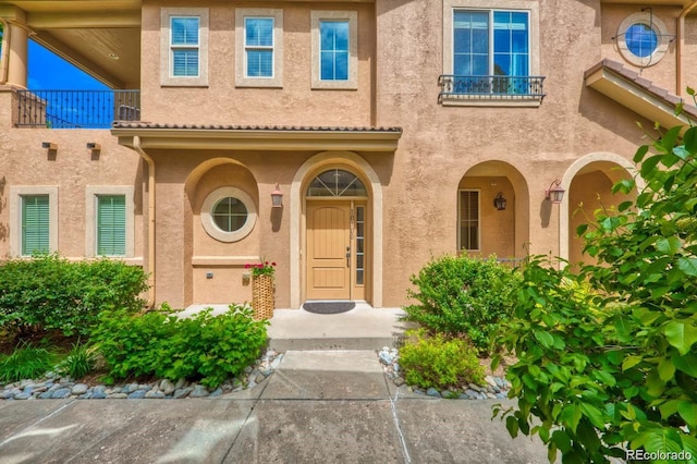 doorway to property with a balcony