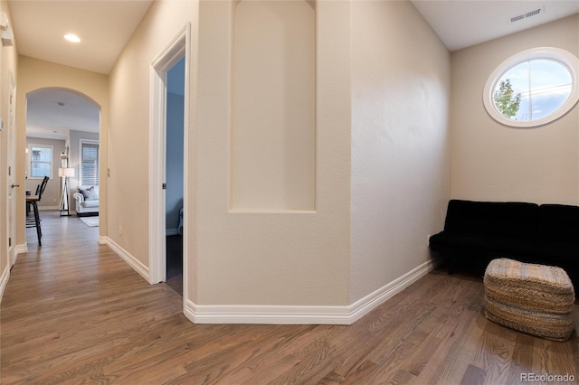 hallway with hardwood / wood-style floors