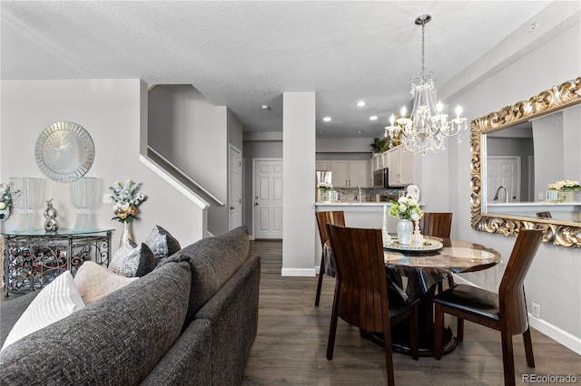 9758 Laredo St Unit 18D, Commerce City, CO 80022 - dining room with an inviting chandelier, a textured ceiling, recessed lighting, baseboards, and dark wood-style floors