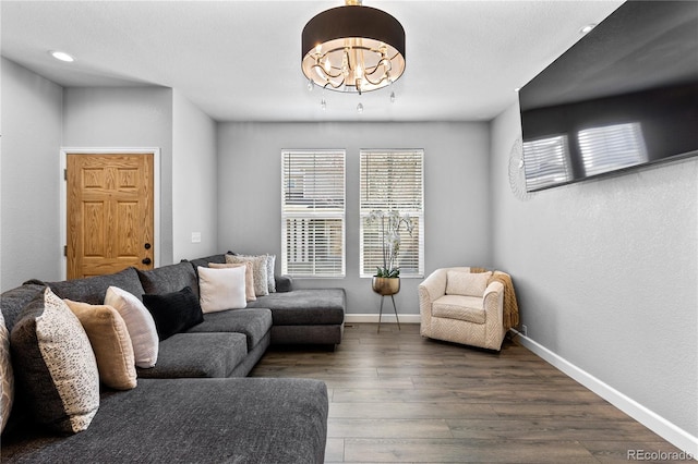 9758 Laredo St Unit 18D, Commerce City, CO 80022 - living room with recessed lighting, baseboards, an inviting chandelier, and wood finished floors