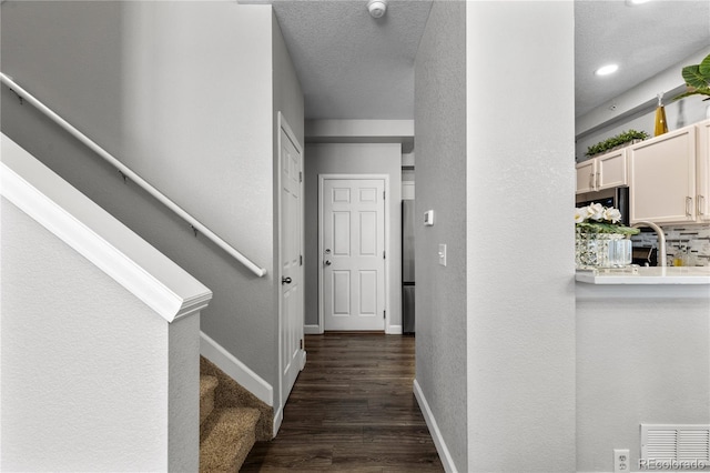 9758 Laredo St Unit 18D, Commerce City, CO 80022 - interior space featuring baseboards, a textured wall, wood finished floors, and visible vents