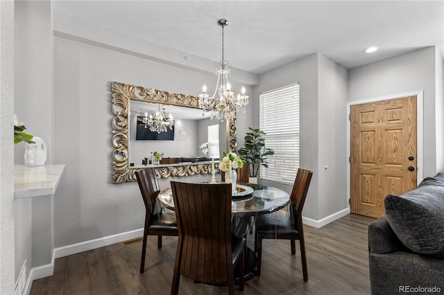 9758 Laredo St Unit 18D, Commerce City, CO 80022 - dining space featuring baseboards, wood finished floors, and a notable chandelier