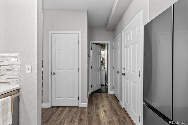 9758 Laredo St Unit 18D, Commerce City, CO 80022 - corridor featuring baseboards, a textured wall, and dark wood-style flooring