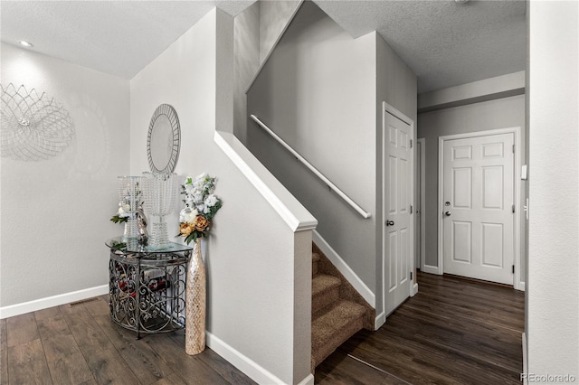 9758 Laredo St Unit 18D, Commerce City, CO 80022 - stairs with baseboards, a textured ceiling, wood finished floors, and visible vents