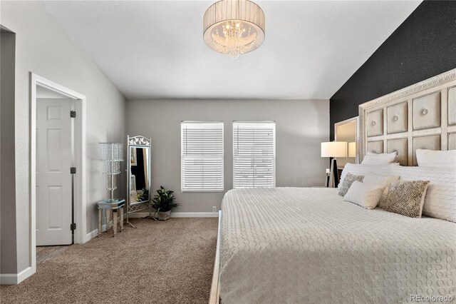9758 Laredo St Unit 18D, Commerce City, CO 80022 - carpeted bedroom with an inviting chandelier, baseboards, and vaulted ceiling