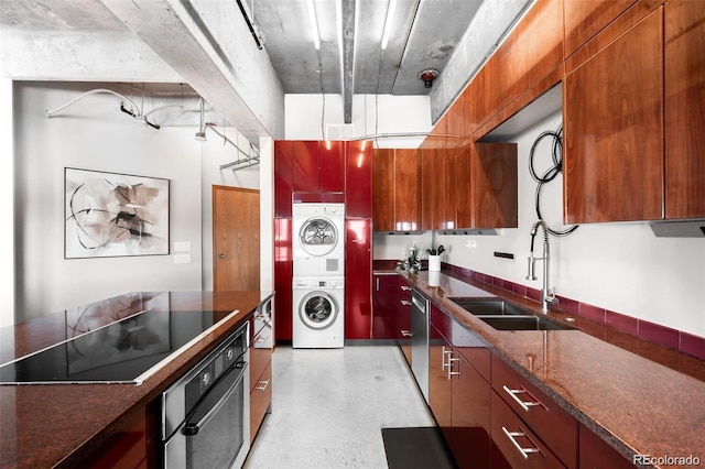100 Park Ave Unit 2008, Denver, CO 80205 - kitchen with appliances with stainless steel finishes, stacked washer / drying machine, and modern cabinets