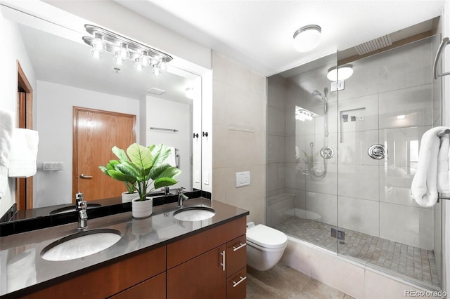 100 Park Ave Unit 2008, Denver, CO 80205 - bathroom featuring double vanity, a shower stall, and tile patterned floors