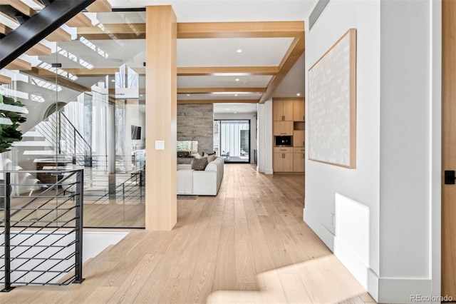 hallway with beamed ceiling and wood-type flooring