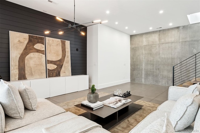 living room with wooden walls