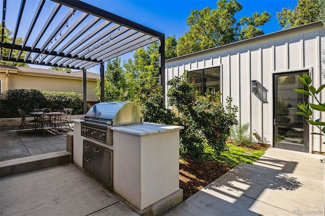 view of patio / terrace with area for grilling, a pergola, and grilling area