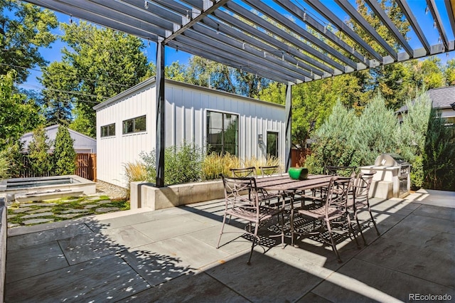 view of patio / terrace with a grill and a pergola