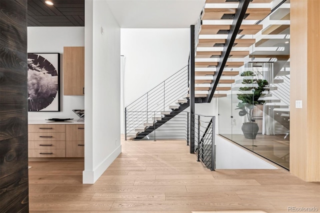 stairway featuring hardwood / wood-style flooring