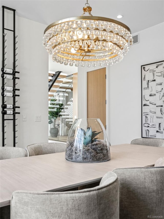 dining space featuring an inviting chandelier