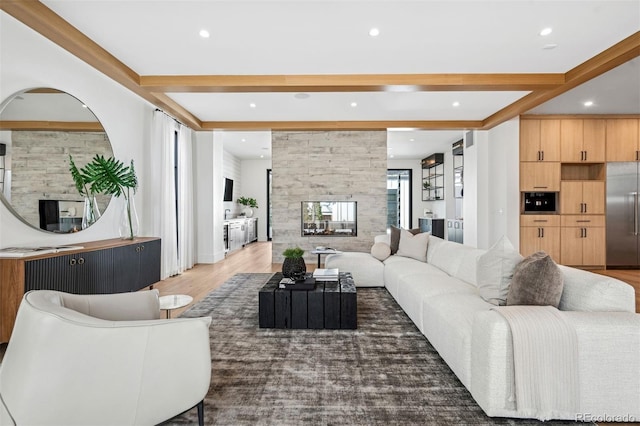 living room featuring beamed ceiling, a multi sided fireplace, and dark hardwood / wood-style floors