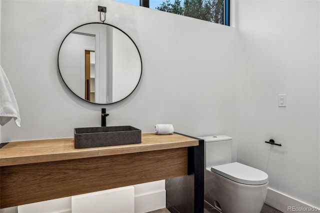 bathroom with vanity and toilet