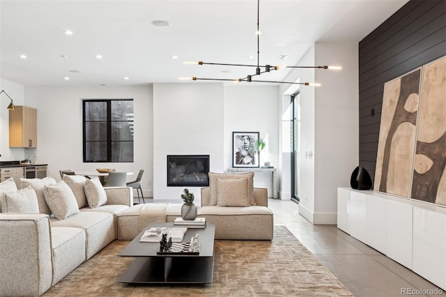 living room with a large fireplace and wooden walls