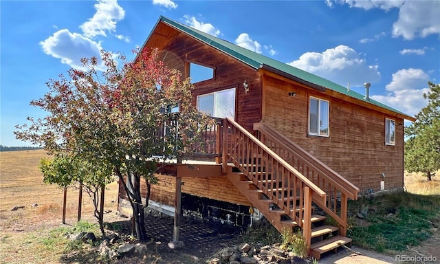 view of property exterior featuring a deck