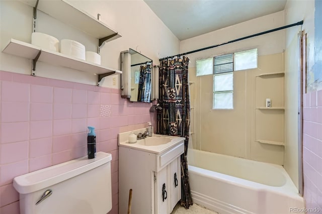 10040 W 13th Pl, Lakewood, CO 80215 - full bath with vanity, shower / bath combo, and tile walls