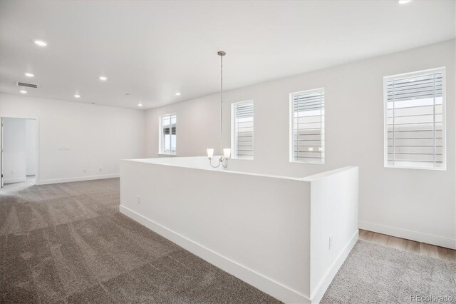 8245 Butte Creek St, Littleton, CO 80125 - hall with carpet flooring, baseboards, and recessed lighting