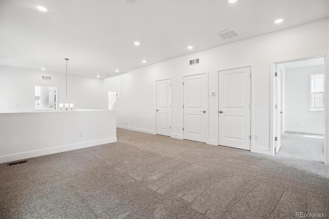 8245 Butte Creek St, Littleton, CO 80125 - carpeted spare room featuring recessed lighting, baseboards, and a chandelier