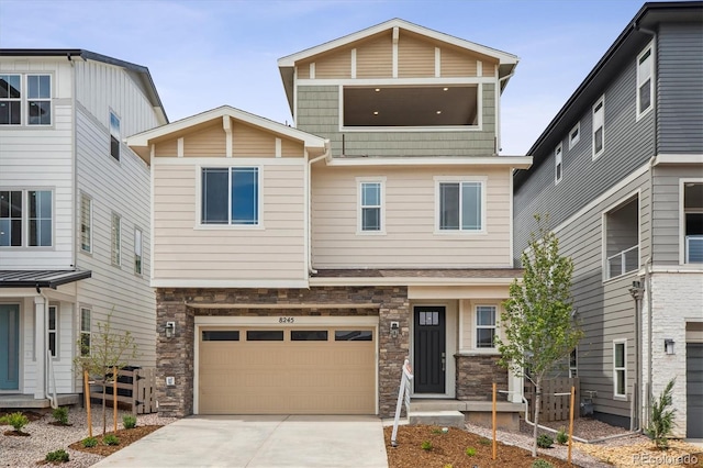 8245 Butte Creek St, Littleton, CO 80125 - view of front of house with stone siding, driveway, and an attached garage