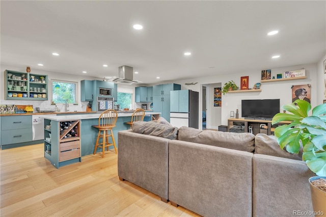3163 S Boston Ct, Denver, CO 80231 - living area with recessed lighting and light wood finished floors