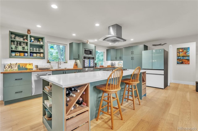 3163 S Boston Ct, Denver, CO 80231 - kitchen featuring open shelves, green cabinetry, stainless steel appliances, island range hood, and a sink